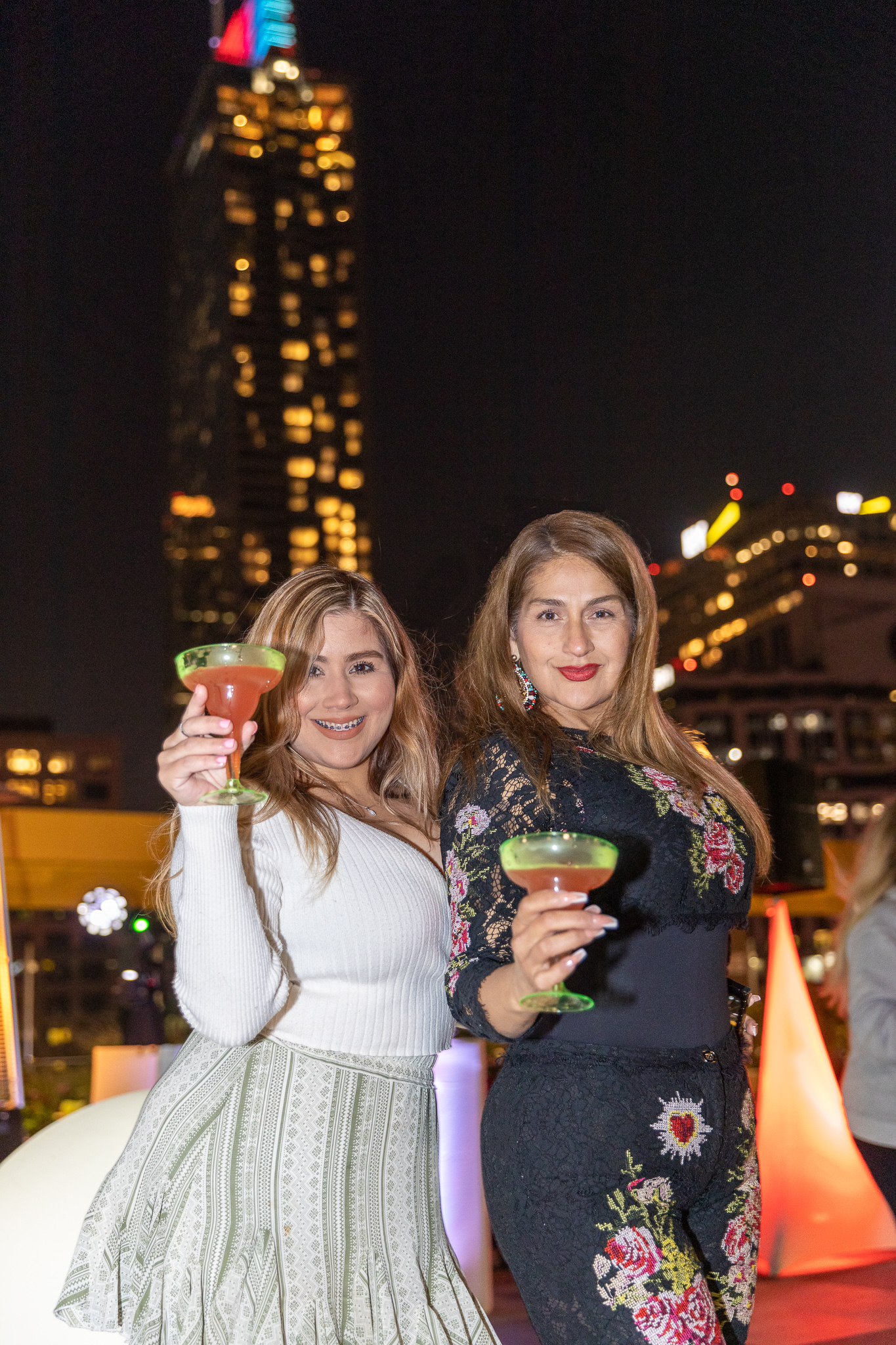 picture of two woman holding their wine glasses