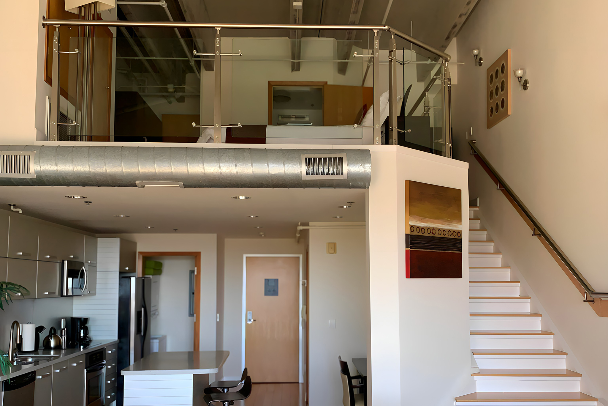 kitchen and dining area in the 1st floor and a staircase to the 2nd floor featuring a balcony and various rooms