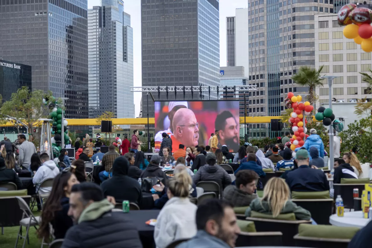 group gathering with a large screen