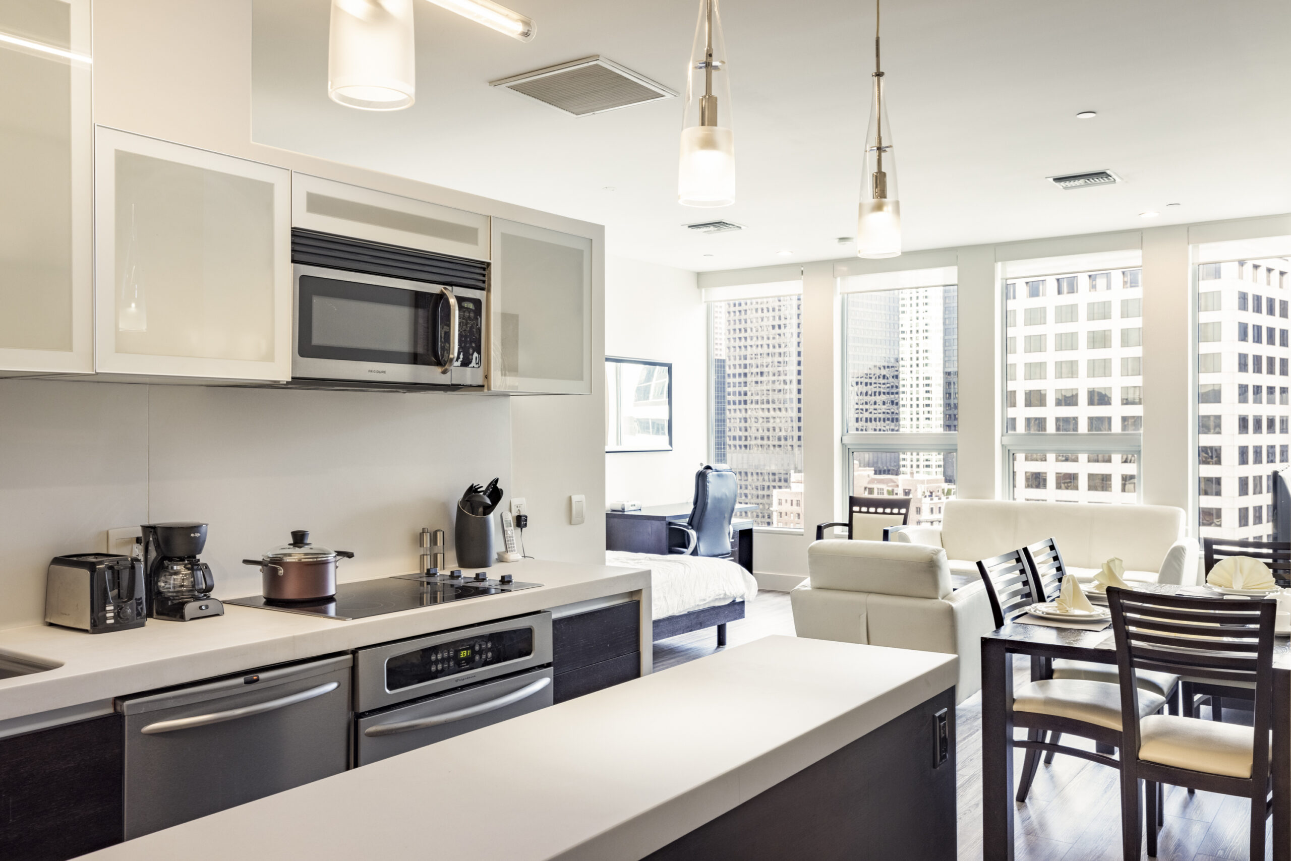 studio type of room, living room, dining, bed, and kitchen area