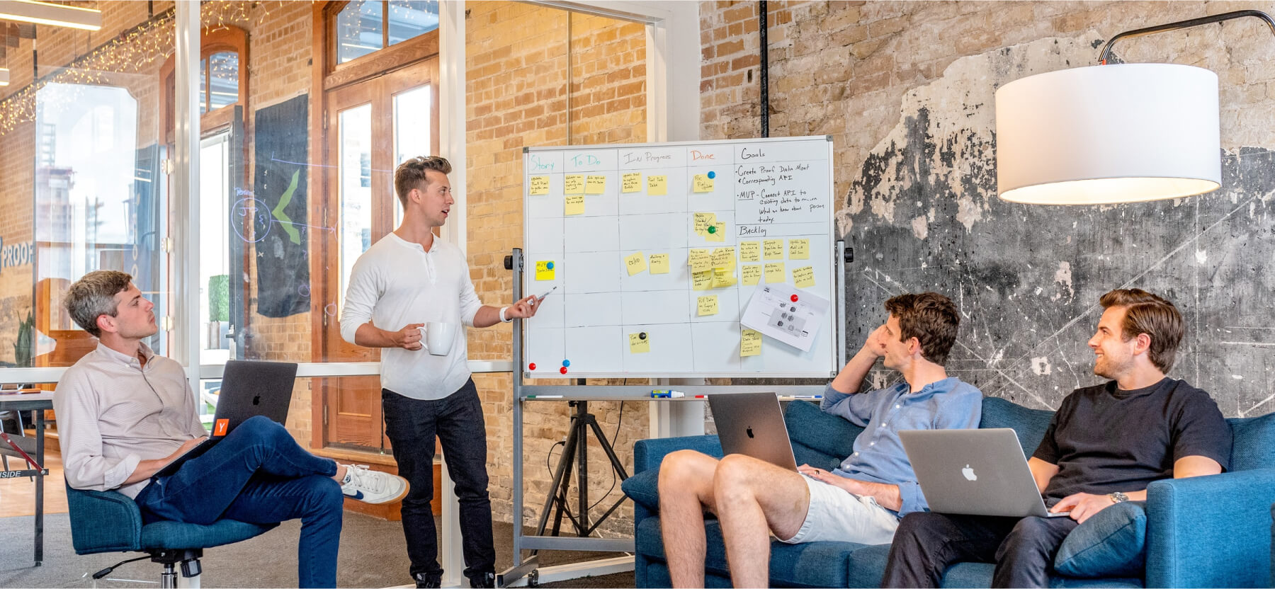 4 people discussing as a team collaboration.