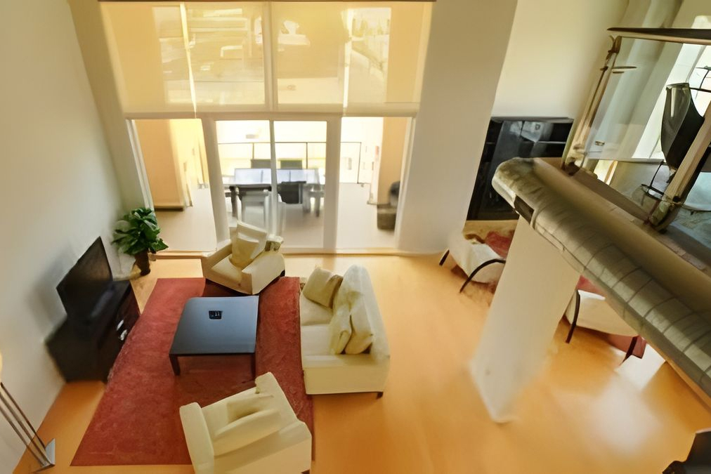 living room with dining area visible through the glass door