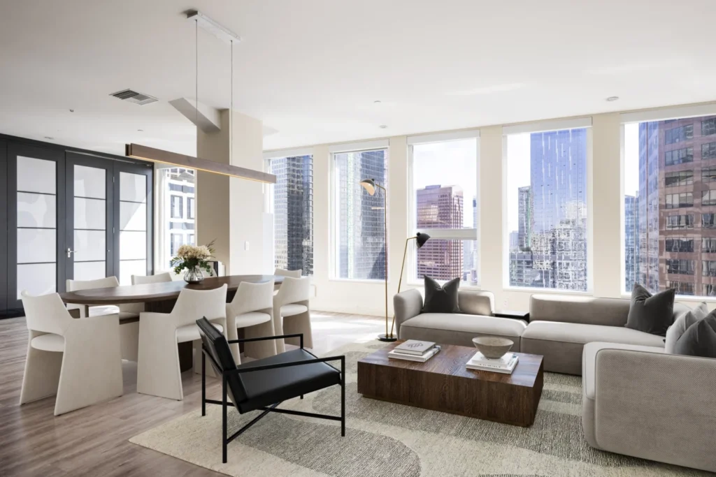 Lounge room with window view towards a city